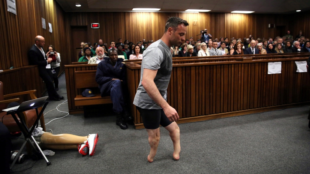 Pistorius walks across the courtroom without his prosthetic legs during the third day of the resentencing hearing on June 15, 2016 [Siphiwe Sibeko/Reuters]