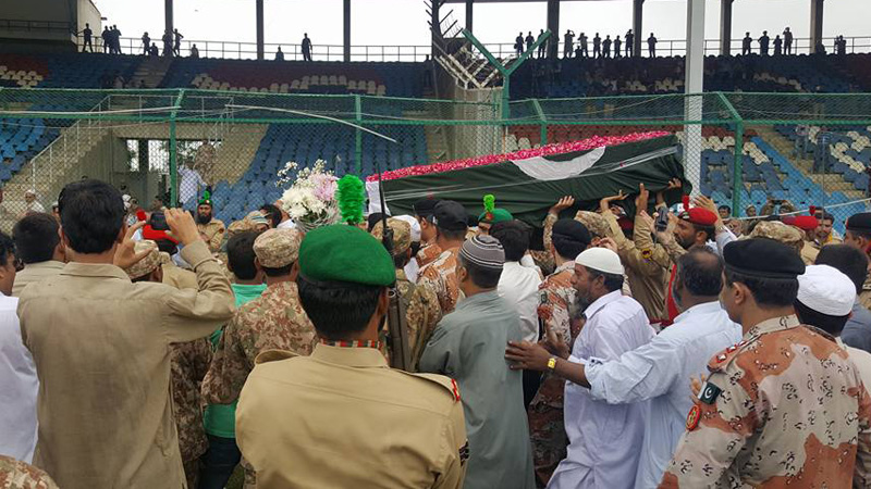 Soldiers carry the coffin of Abdul Sattar Edhi at Karachi's National Stadium [Ali Manzoor / Al Jazeera]