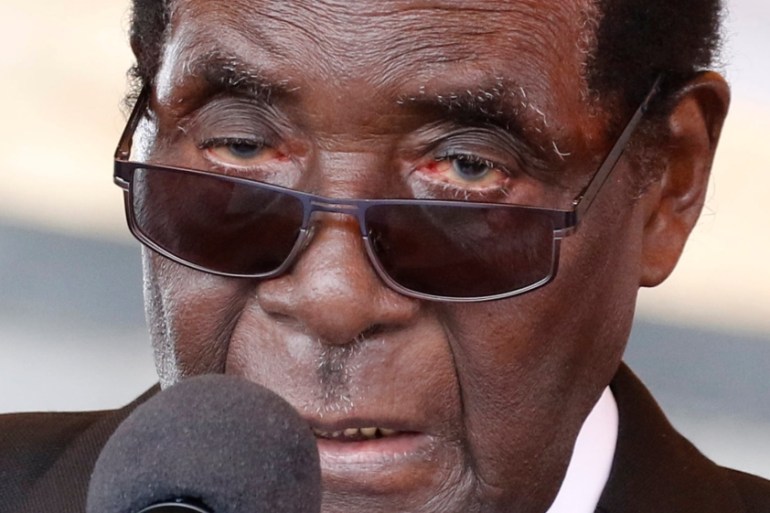 Zimbabwe''s President Robert Mugabe addresses mourners gathered for the burial of National Hero Charles Utete at the Heroes Acre in Harare