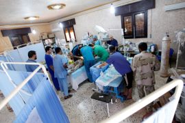 Doctors perform an operation on an injured soldier from forces aligned with Libya''s new unity government at a field hospital in Sirte