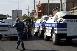 Policemen block a street after group of armed men seized a police station along with an unknown number of hostages, according the country''s security service, in Yerevan, Armenia