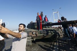 A man takes a selfie in front of a tank after troops involved in the coup surrendered on the Bosphorus Bridge in Istanbul