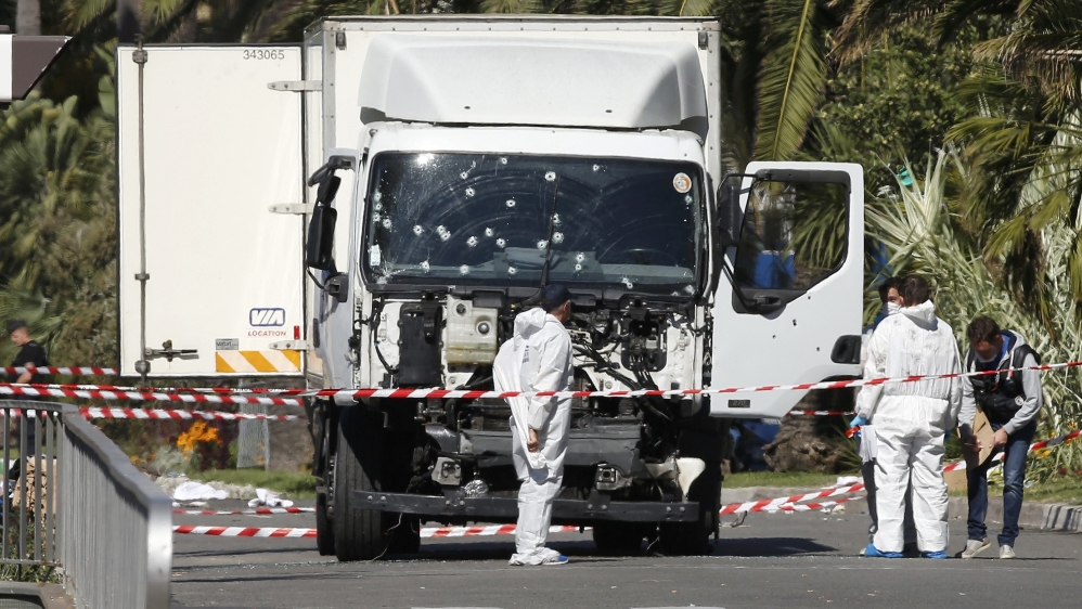 Investigators work at the scene near the lorry that ran into a crowd in the southern city of Nice [Eric Gaillard/Reuters]