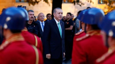 President Tayyip Erdogan reviews a guard of honour as he arrives at the Turkish parliament in Ankara [Reuters]