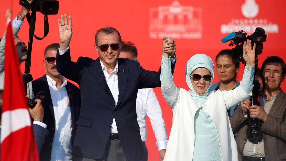 Erdogan and his wife greeted the crowds [Emrah Gurel/AP]