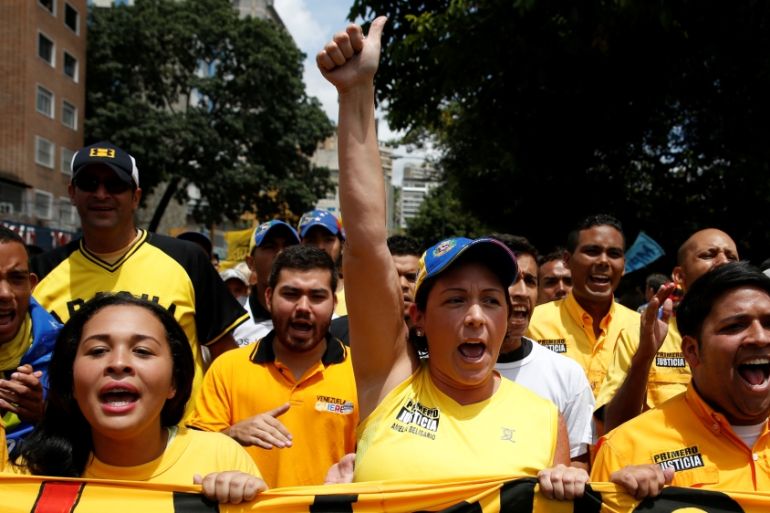 Opposition supporters shout slogans during a rally to demand a referendum to remove President Nicolas Maduro in Caracas