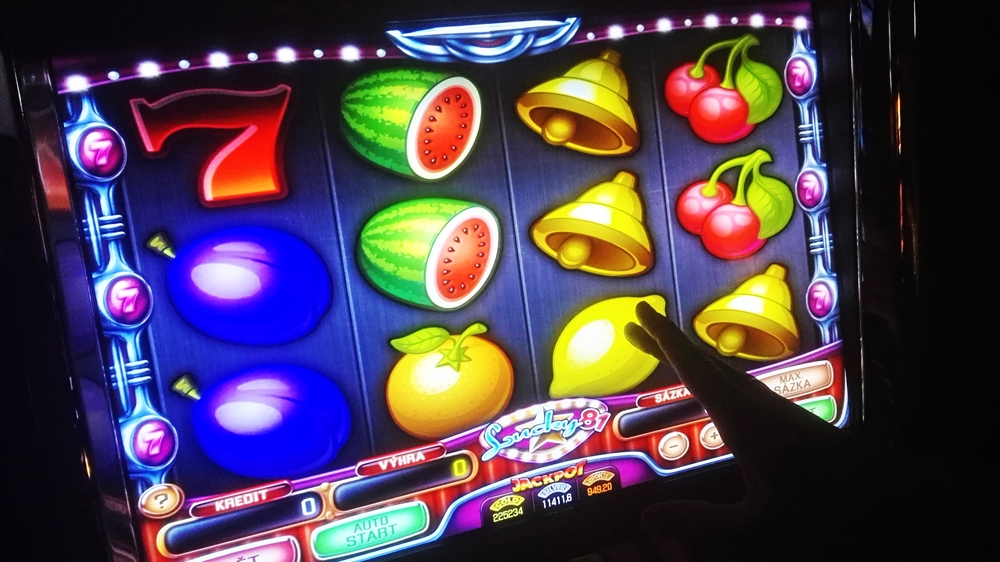   Slot machines are a favourite among Czechs who are often given free alcohol to keep playing [Philip Heijmans/Al Jazeera]