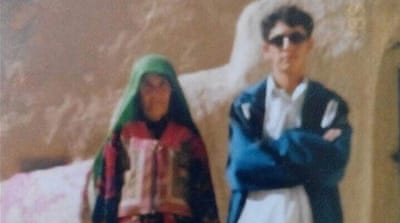  Bismillah Ranjbar with his mother in 1996 [Courtesy of Bismillah Ranjbar] 