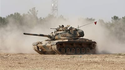 Turkish tanks on their way near the Turkish-Syria border during an operation against ISIL on August 24 [EPA]