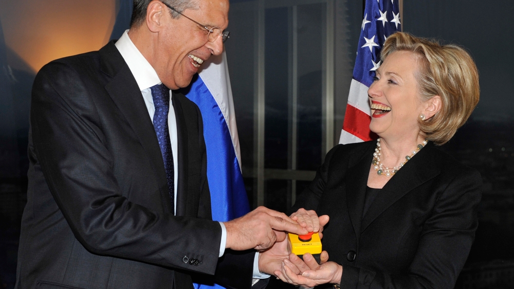 Clinton, right, and Lavrov press a red button symbolising the intention to 'reset' US-Russian relations during their meeting in Geneva, Switzerland, in 2009 [AP]