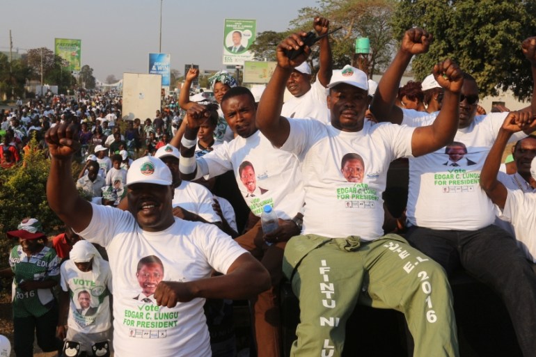 Supporters of Edgar Lungu, leader of the Patriotic Front party (PF), celebrate after Lungu narrowly won re-election on Monday, in a vote his main rival Hakainde Hichilema rejected on claims of alleged