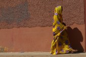 A woman walks in Laayoune, Western Sahara on May 7, 2013 [Getty]