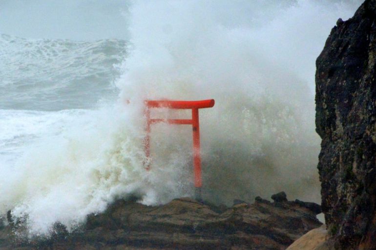 High waves triggered by Typhoon Lionrock crash against a "torii" gate on a coast of the city of Iwaki, Fukushima Prefecture, Japan