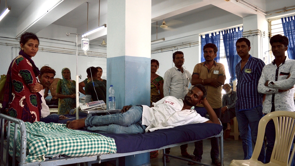 Construction worker Manoj Makwana tried to commit suicide after police disrupted a Dalit rally in Rajkot. In hospital, he was surrounded by friends and supporters [Maya Prabhu/Al Jazeera]
