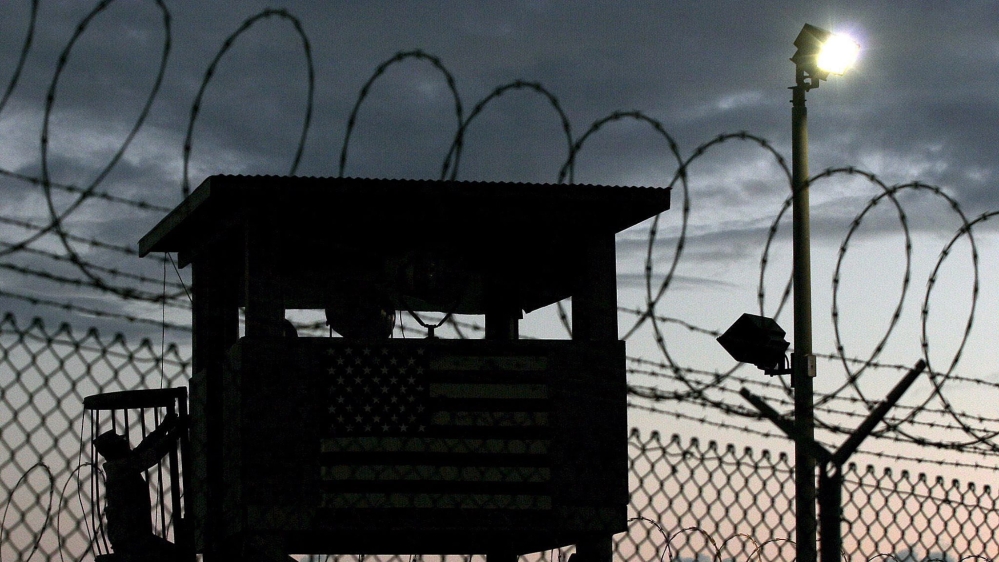 A Joint Task Force member climbs to his guard tower at Camp Delta in Guantanamo Bay [EPA/JOHN RILEY]