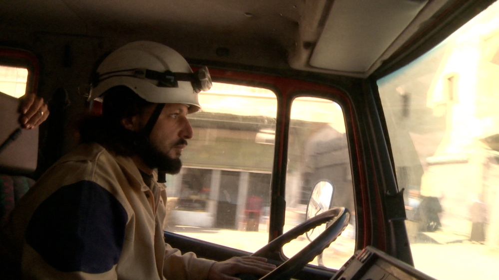 Abdul Qader, the team's driver, heads to the site of a bombing [Nagieb Khaja/Al Jazeera]