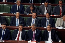 Tunisian Prime Minister Essid, Justice Minister Mansour, Tunisian Defense Minister Horchani and Interior Minister Majdoub attend a plenary session at the Assembly of People''s Representatives in Tunis