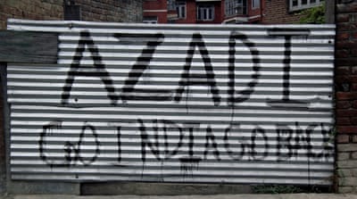 Graffiti reading Azadi (freedom) and Go India Back in Srinagar, Kashmir [Elizabeth Puranam/Al Jazeera]