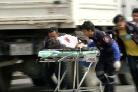 Rescuers and medical officers push an injured person on a gurney at the site of a bomb blast in Hua Hin, south of Bangkok