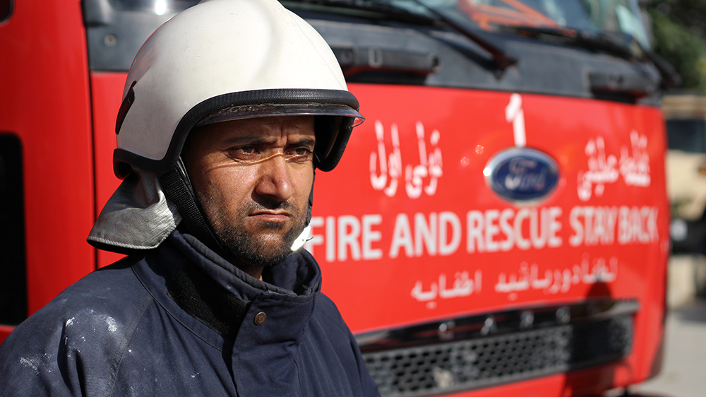 Shafiullah Karimi, 32, couldn't eat or sleep properly for a week after he tried to lift a victim's burnt body. [Maija Liuhto/Al Jazeera]