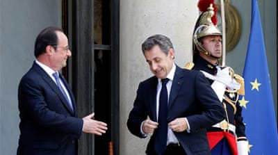 French President Francois Hollande welcomes Nicolas Sarkozy at the Elysee Palace in Paris, June 25 [Reuters]