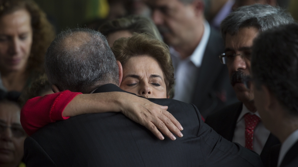 The Workers' Party under Rousseff and her predecessor Luiz Inacio Lula da Silva is credited with raising around 29 million Brazilians out of poverty [Leo Correa/AP]