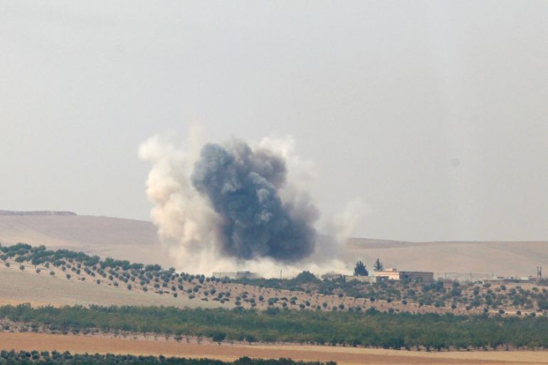 Smoke rises from the Syrian border town of Jarablus as it is pictured from the Turkish town of Karkamis