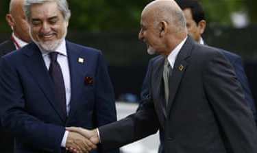 Afghanistan''s President Ghani shakes hands with Afghanistan''s Chief Executive Abdullah as they arrive for the NATO Summit in Warsaw