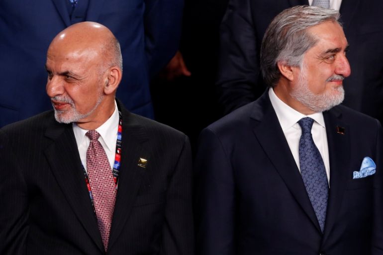 Ghani and Abdullah participate in a family photo with Ghani and Abdullah at the NATO Summit in Warsaw, Poland