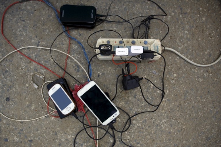 Cellphones pictured charging as a generator circulates power due to a power cut after an earthquake in Kathmandu