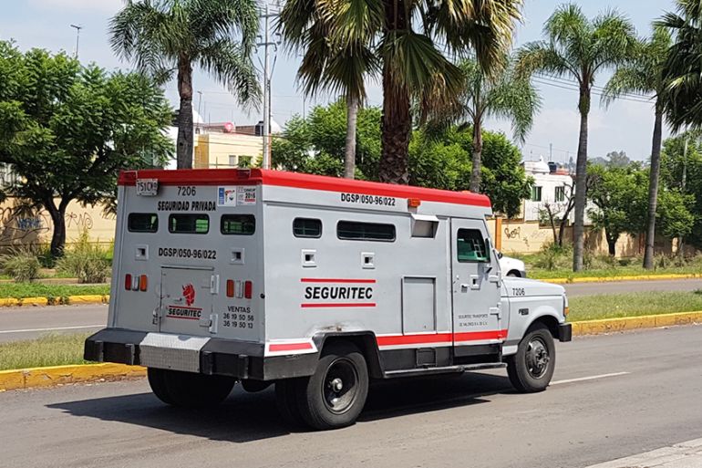 A Seguritec van rumbles through Guadalajara.