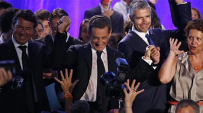 Former President Sarkozy, centre, greets supporters during his first political campaign rally in Chateaurenard on August 25 [EPA]