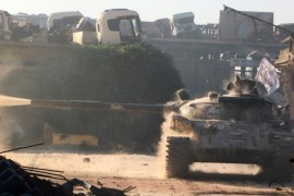 A Free Syrian Army tank fires in Ramousah area southwest of Aleppo