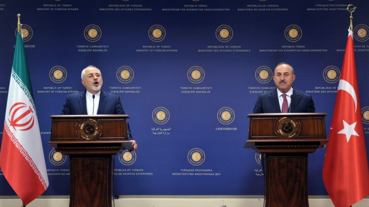 Iranian Foreign Minister Mohammad Javad Zarif and his Turkish counterpart Mevlut Cavusoglu attend a news conference in Ankara