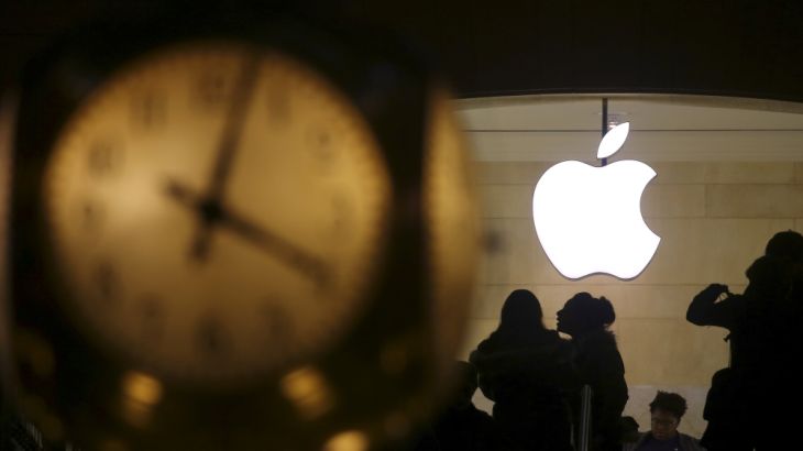 The Apple logo is pictured behind the clock at Grand Central Terminal in the Manhattan borough of New York