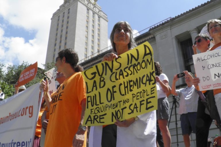 Members of the University of Texas of the Guns Free UT group that includes faculty and staff protest against a state law that allows for guns in classrooms at college campuses, in Austin, Texas