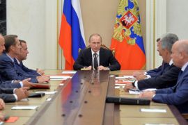 Russian President Putin chairs meeting with members of Security Council to discuss additional security measures for Crimea after clashes on contested peninsula at Kremlin in Moscow
