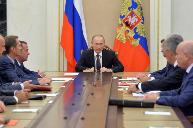 Russian President Putin chairs meeting with members of Security Council to discuss additional security measures for Crimea after clashes on contested peninsula at Kremlin in Moscow