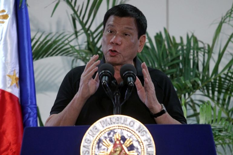Philippines President Rodrigo Duterte gestures during a news conference upon his arrival from Vietnam trip at the International Airport in Davao city