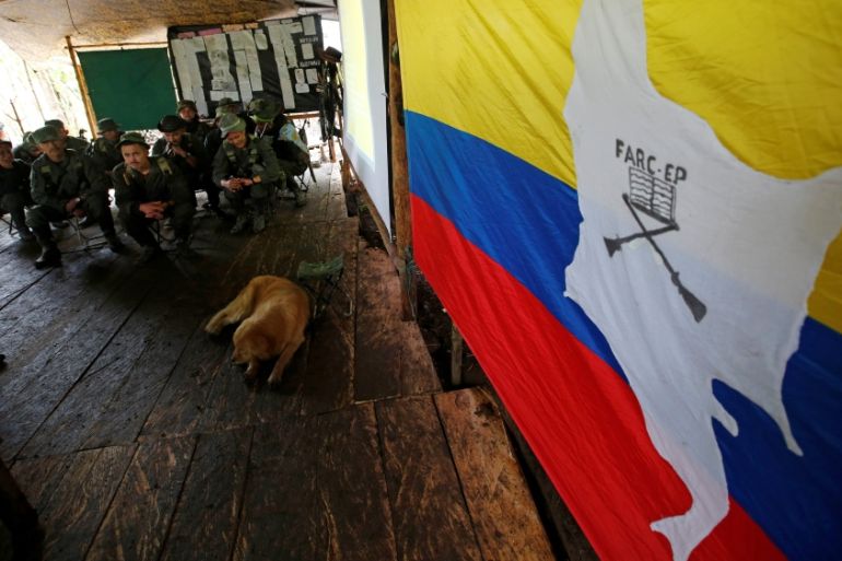 Members of the 51st Front of the Revolutionary Armed Forces of Colombia (FARC) listen to a lecture on the peace process between the Colombian government and their force at a camp in Cordillera Orienta