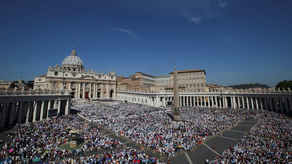 Canonisation mass is attended by tens of thousands of Catholic pilgrims [Reuters]