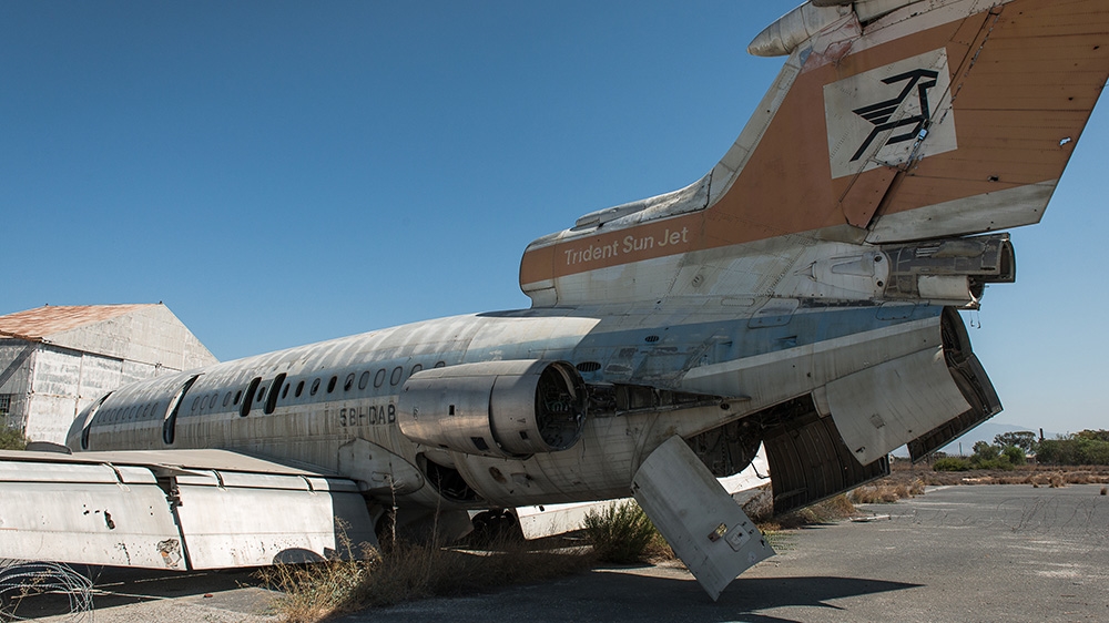 An abandoned plane rests at the old Nicosia Airport, which fell into disuse in 1974 and constitutes part of the UN buffer zone in Cyprus [Wojtek Arciszewski/Al Jazeera]