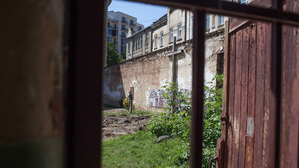 Researchers uncovered more than a dozen human remains in the courtyard of the Lontsky Prison, which is now a museum to local victims of repression  [Dan Peleschuk/ Al Jazeera]