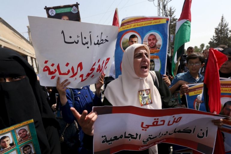Demonstrators take part in a protest against the abduction of four Palestinians in Egypt''s Sinai last month, at the gate of Rafah crossing between Egypt and southern Gaza Strip