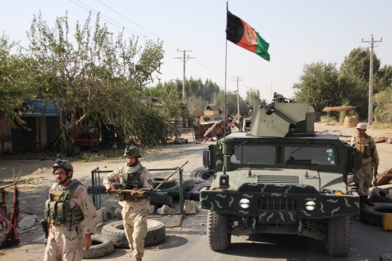 Afghan security officials patrol in Aachin district of Kunduz, Afghanistan [EPA]n
