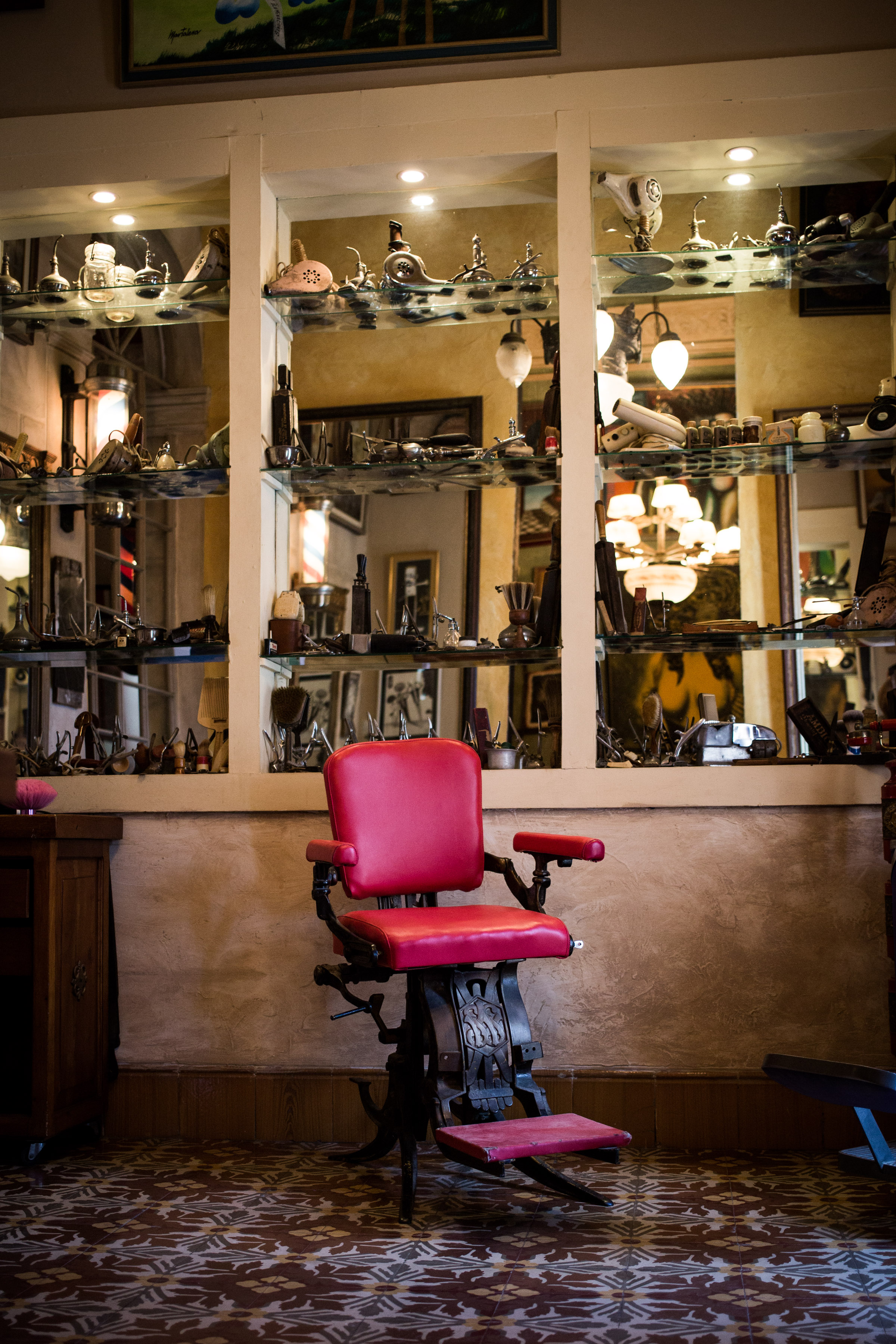 Papito collects vintage hairdressing tools and chairs for his barber shop [Al Jazeera]