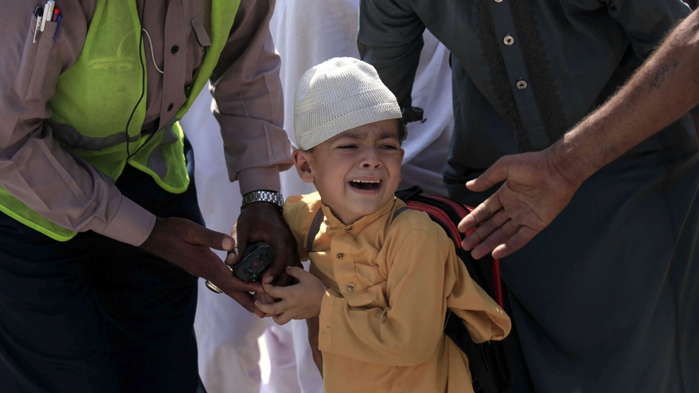 A school boy cries following a blast targeting a Christian colony in Peshawar [Bilawal Arbab/EPA]