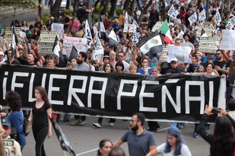 Thousands of people march against President Pena Nieto