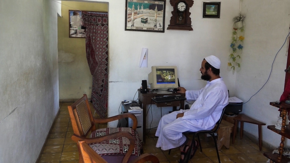 Hassan Jan, 43, a Cuban Muslim convert runs a small printing business from his home [Sylvia Hines/Al Jazeera]