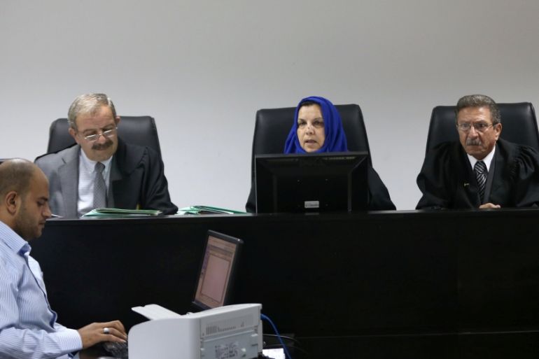 Palestinian judges discuss a petition to suspend municipal elections, at the High Court office in the West Bank city of Ramallah